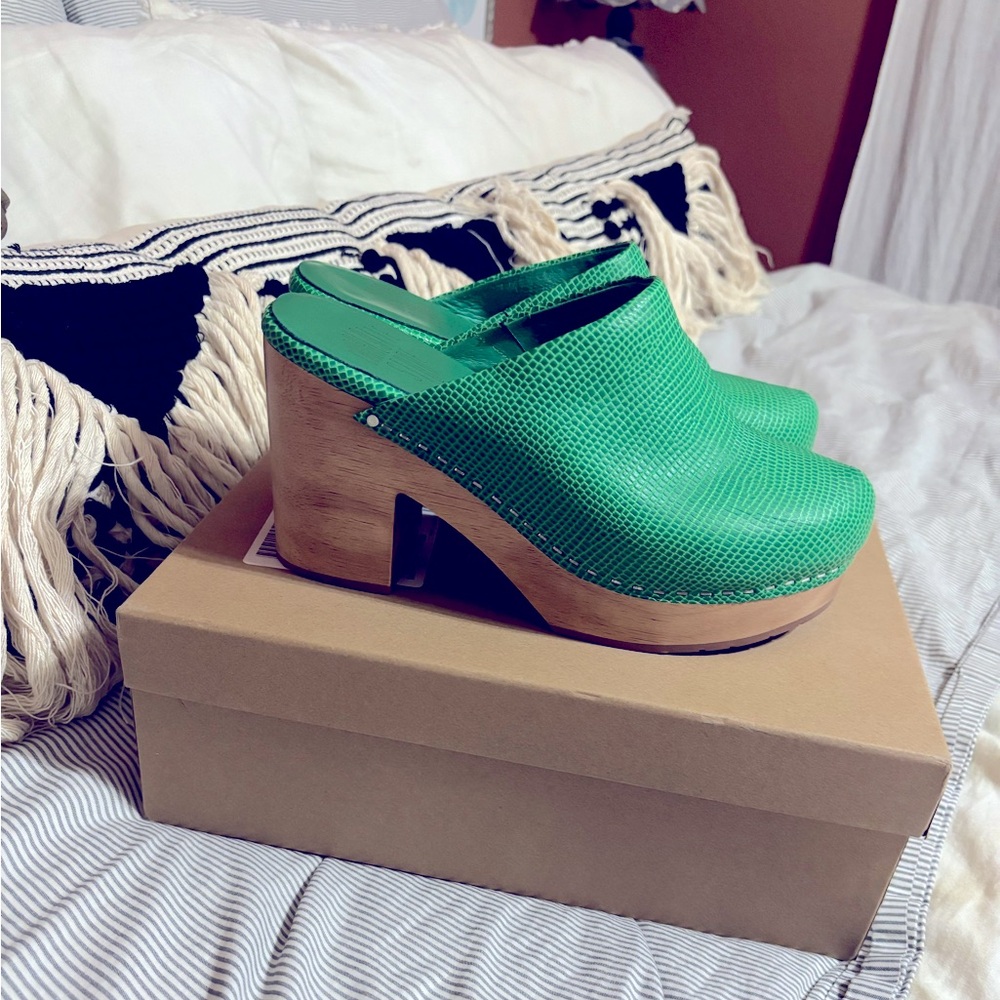 Worn once. beautiful Texas Hot Mint green clogs. Comes with box.